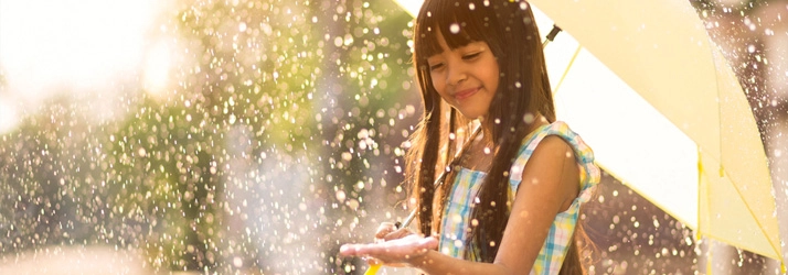 A happy girl in the rain.